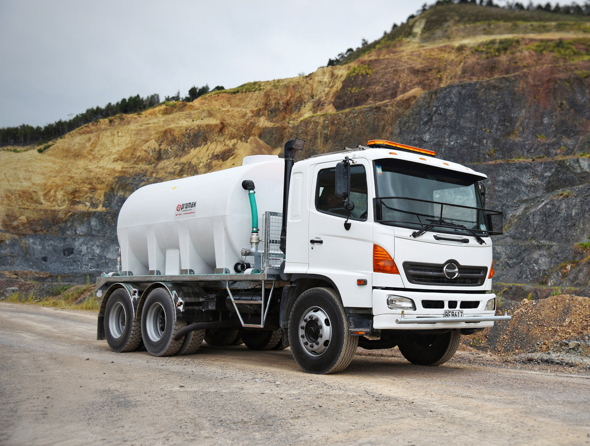 A Promax dust suppression unit on a Hino truck on a quarry road