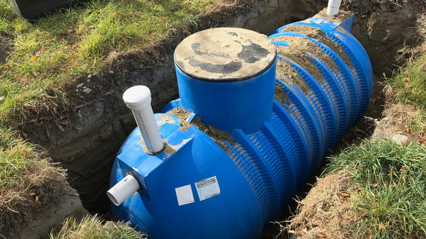 Promax septic tank being installed and backfilled in a trench on a New Zealand property
