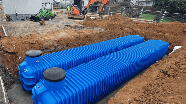 Two Promax underground tanks being installed in a trench on a New Zealand residential build site
