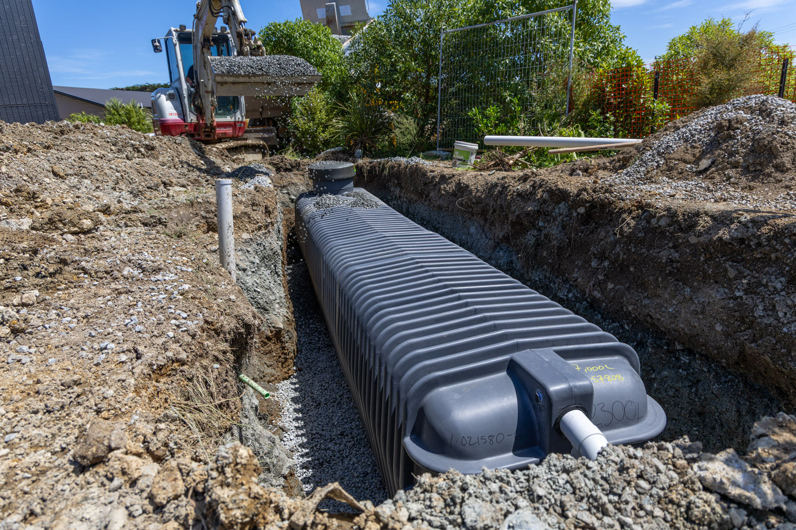 Promax underground tank being installed for water storage.